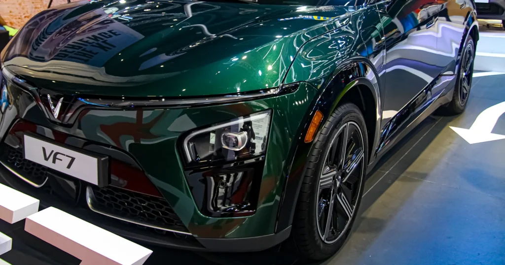 Front and side detail of a dark VinFast VF 7 at the 2025 Manila International Auto Show